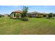 Spacious green backyard with well-maintained lawn and landscaping around the perimeter of the property at 11354 Callisia Dr, Odessa, FL 33556