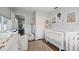 Well-organized Bedroom with dual cribs, built-in storage, and an adjacent sitting room at 11720 80Th Ave, Seminole, FL 33772