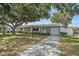 Charming home featuring a well-maintained front yard, a welcoming entrance, and a private garage at 11720 80Th Ave, Seminole, FL 33772