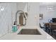 A kitchen sink shows a detailed view of the faucet and backsplash at 11720 80Th Ave, Seminole, FL 33772