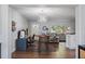 Open-concept living space with modern lighting, and an adjacent seating area at 11720 80Th Ave, Seminole, FL 33772