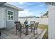 Charming outdoor patio area with seating, perfect for enjoying meals and gatherings at 11720 80Th Ave, Seminole, FL 33772