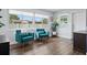 Bright sitting room with hardwood floors, large windows, and comfortable chairs at 11720 80Th Ave, Seminole, FL 33772