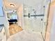 Beautifully renovated bathroom featuring a glass shower and ceramic tile flooring at 11821 Easthampton Dr, Tampa, FL 33626