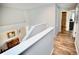 Upstairs hallway looking into an en-suite bathroom at 11821 Easthampton Dr, Tampa, FL 33626