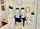 Eat in kitchen featuring a black table with chairs with a view of the pool in the back yard at 11821 Easthampton Dr, Tampa, FL 33626