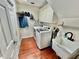 Well-equipped laundry room with modern washer and dryer, storage cabinets, and utility sink at 11821 Easthampton Dr, Tampa, FL 33626