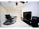 Cozy loft area featuring a comfortable chair and TV, perfect for relaxation and entertainment at 11821 Easthampton Dr, Tampa, FL 33626