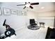 Bright loft area with exercise bike and decor; a flexible space for relaxation or fitness at 11821 Easthampton Dr, Tampa, FL 33626