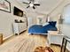 This main bedroom has wood flooring and a ceiling fan at 11821 Easthampton Dr, Tampa, FL 33626