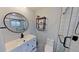 Well-lit bathroom features a modern vanity, sleek black fixtures, and a tiled shower at 1200 47Th St N, St Petersburg, FL 33713