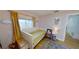 Cozy bedroom with a window, rug, and unique decorations at 1200 47Th St N, St Petersburg, FL 33713