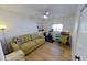Versatile bedroom with an exercise bike, sofa, desk and built-in bookshelves at 1200 47Th St N, St Petersburg, FL 33713