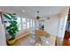 Sunny dining room with hardwood floors, large windows, and a modern chandelier at 1200 47Th St N, St Petersburg, FL 33713