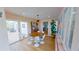 Dining room with round table, modern light fixture, and sliding doors to an outdoor area at 1200 47Th St N, St Petersburg, FL 33713