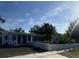 Well-maintained home with mature landscaping, and a white picket fence at 1200 47Th St N, St Petersburg, FL 33713