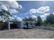 Charming single-story home with a carport, white picket fence, and well-maintained lawn at 1200 47Th St N, St Petersburg, FL 33713
