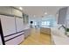 Open-concept kitchen flows into the living area, featuring modern appliances and plenty of countertop space at 1200 47Th St N, St Petersburg, FL 33713