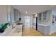 Well-lit kitchen featuring modern appliances and a view into the dining area at 1200 47Th St N, St Petersburg, FL 33713