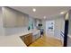 Stylish kitchen with gray cabinets, stainless steel appliances, and a view into the dining room at 1200 47Th St N, St Petersburg, FL 33713