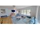 Comfortable living room with modern furnishings, a large window, and an open layout at 1200 47Th St N, St Petersburg, FL 33713