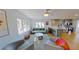 Living room featuring hardwood floors, an open floor plan, and seamless flow to the kitchen at 1200 47Th St N, St Petersburg, FL 33713