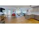 Open-concept living room featuring modern furniture, bright decor, and plenty of natural light at 1200 47Th St N, St Petersburg, FL 33713