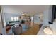 Open-concept living room flows into the kitchen, featuring hardwood floors and recessed lighting at 1200 47Th St N, St Petersburg, FL 33713
