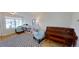 Cozy living room with a piano, hardwood floors, a checkered rug, and comfortable seating at 1200 47Th St N, St Petersburg, FL 33713