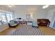 Bright living room featuring hardwood floors, a cozy rug, and a charming piano at 1200 47Th St N, St Petersburg, FL 33713