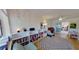 Bright living room featuring a bookshelf, cozy seating, and a sliding glass door for lots of natural light at 1200 47Th St N, St Petersburg, FL 33713