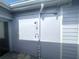 A simple outdoor shower is conveniently located on the exterior of the home at 1200 47Th St N, St Petersburg, FL 33713