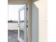Balcony with wooden flooring and beautiful outdoor view through glass door providing natural light at 1218 E Kay St # 21, Tampa, FL 33602
