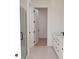 Modern bathroom with white cabinets, black hardware, frameless glass shower, and neutral tile at 1218 E Kay St # 21, Tampa, FL 33602