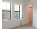 Bright bedroom with two windows and white trim at 1218 E Kay St # 21, Tampa, FL 33602