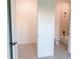 Bright bedroom leading to ensuite bathroom at 1218 E Kay St # 21, Tampa, FL 33602
