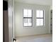 Bright bedroom with two windows and light wood flooring at 1218 E Kay St # 21, Tampa, FL 33602