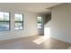 Living room featuring light wood floors, large windows, and bright, natural light with lots of space at 1218 E Kay St # 21, Tampa, FL 33602