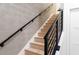 Modern staircase with black metal railing and light wood treads at 1218 E Kay St # 21, Tampa, FL 33602