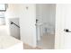 Bright bathroom with pedestal sink, tile floor, and modern fixtures at 1218 E Kay St # 24, Tampa, FL 33602