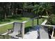 View from the backyard deck with two chairs at 12929 Sugar Creek Blvd, Hudson, FL 34669