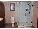Bathroom featuring a toilet, vanity and a modern glass enclosed shower at 12929 Sugar Creek Blvd, Hudson, FL 34669
