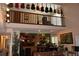 Overlook of the bonus room featuring display of guitars and music themed setup at 12929 Sugar Creek Blvd, Hudson, FL 34669