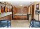 Bonus room with built-in shelving, wood trim, and a carpeted floor at 12929 Sugar Creek Blvd, Hudson, FL 34669