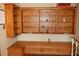 Built-in shelving and lower cabinets with a wood finish at 12929 Sugar Creek Blvd, Hudson, FL 34669