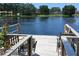 Lake view from the wooden dock with chairs at 12929 Sugar Creek Blvd, Hudson, FL 34669