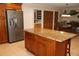 Spacious kitchen featuring an island with granite countertops and stainless steel appliances at 12929 Sugar Creek Blvd, Hudson, FL 34669