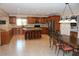 Spacious eat-in kitchen with center island, stainless appliances, and barstool seating at 12929 Sugar Creek Blvd, Hudson, FL 34669