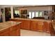 Open-concept kitchen with a spacious island, perfect for food preparation and casual dining at 12929 Sugar Creek Blvd, Hudson, FL 34669