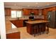 Kitchen with center island, stainless appliances, and light granite counters at 12929 Sugar Creek Blvd, Hudson, FL 34669